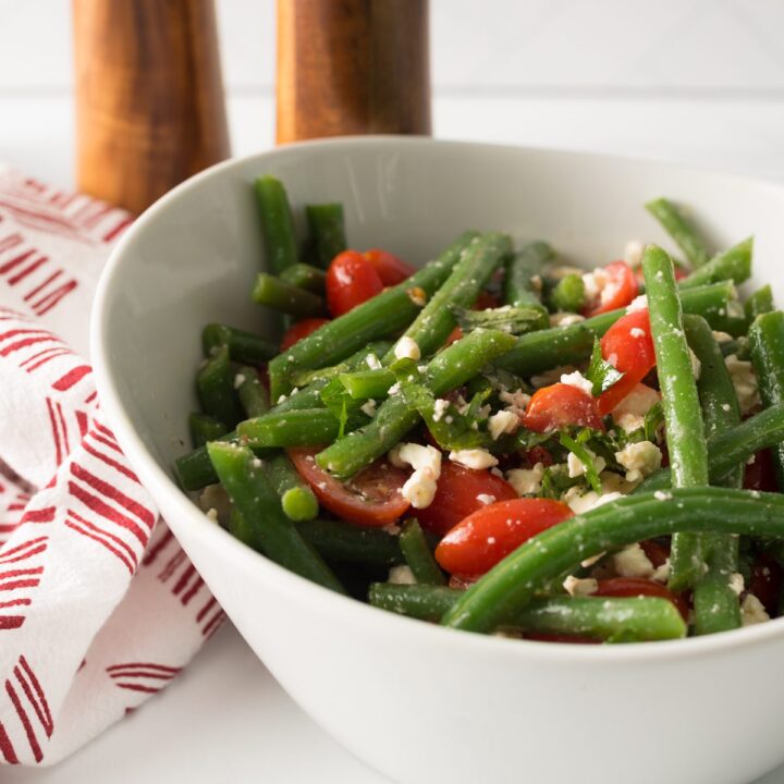 Fresh green beans with tomato and feta cheese combined with herbs and spices