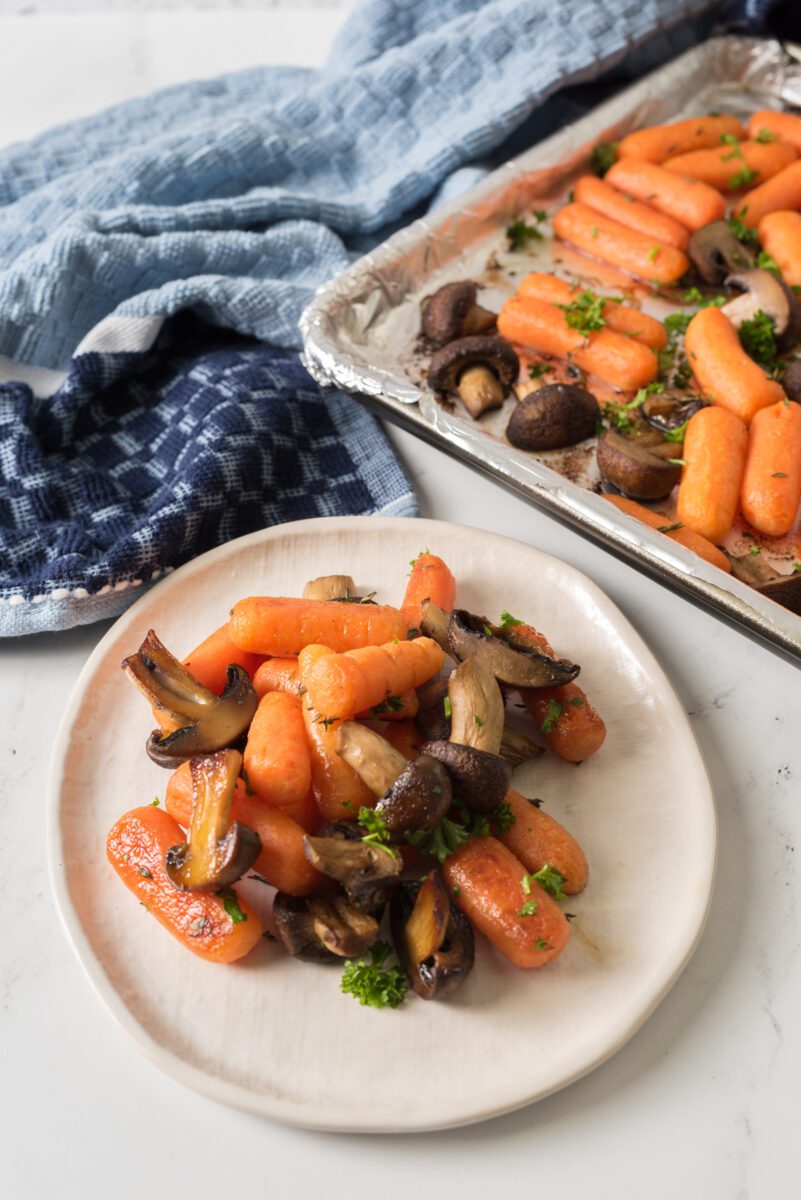 carrots and mushrooms on a sheetpan