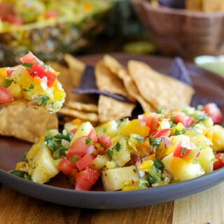 Salsa made with pineapple and in a Pineapple rind bowl