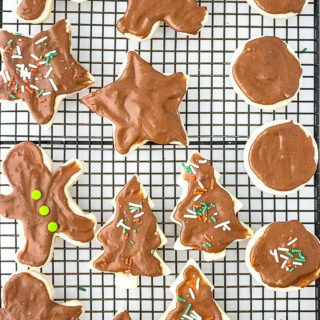 Sugar cookies cut out Christmas cookie cutter decorated with Nutella Frosting