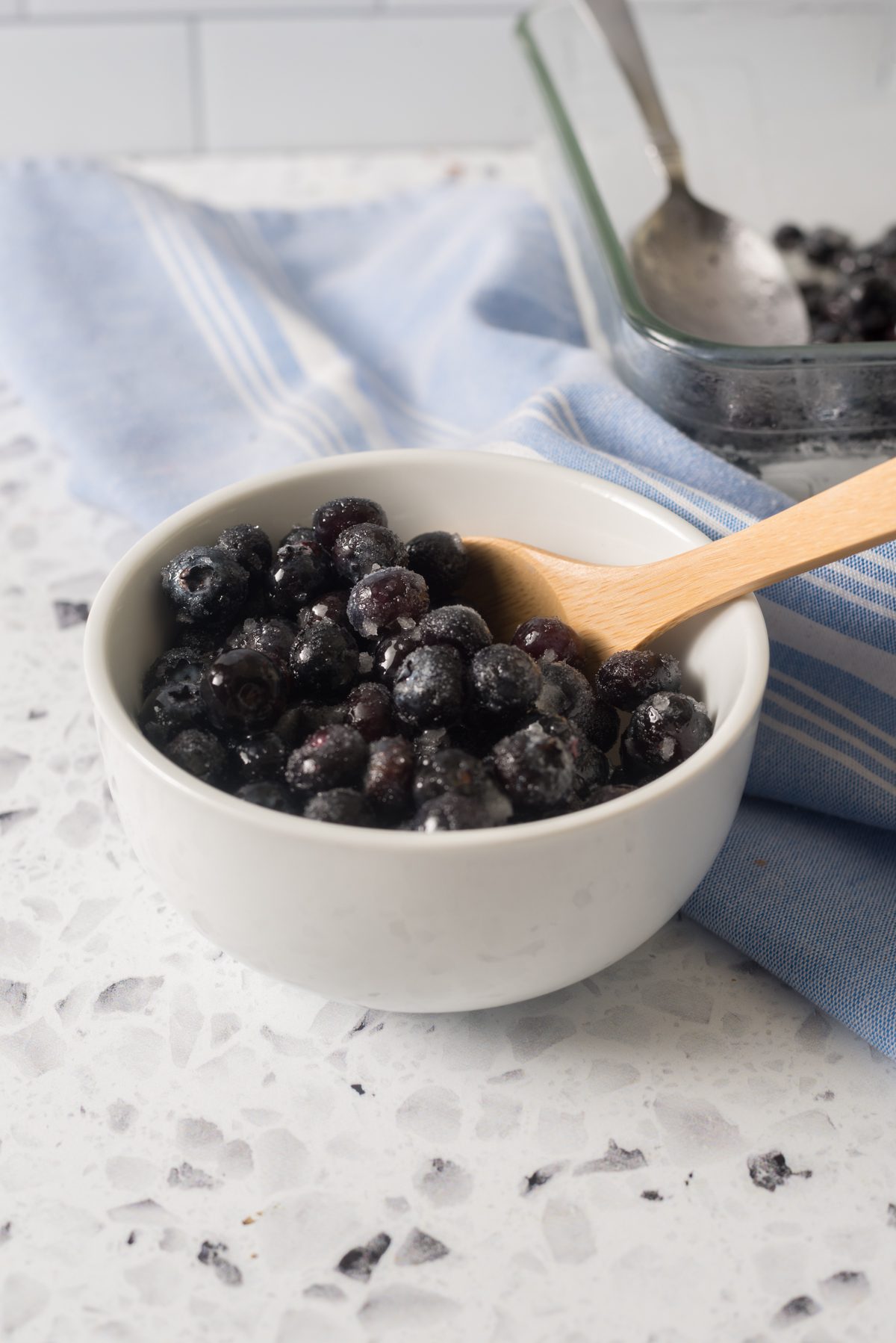 Super simple frozen snack made with blueberries, lemon juice and sugar.