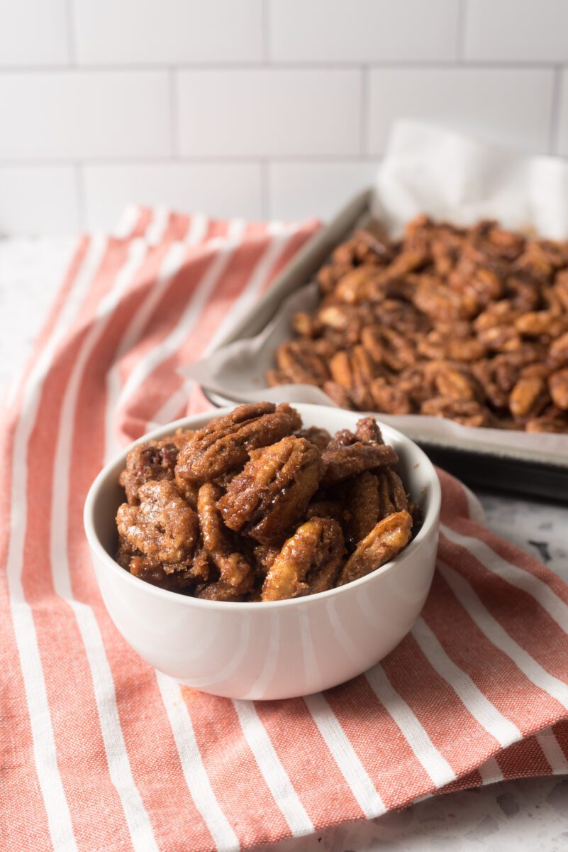 Pecans that have been evenly coated with sugar and cinnamon and baked in the oven like TikTok says to do!