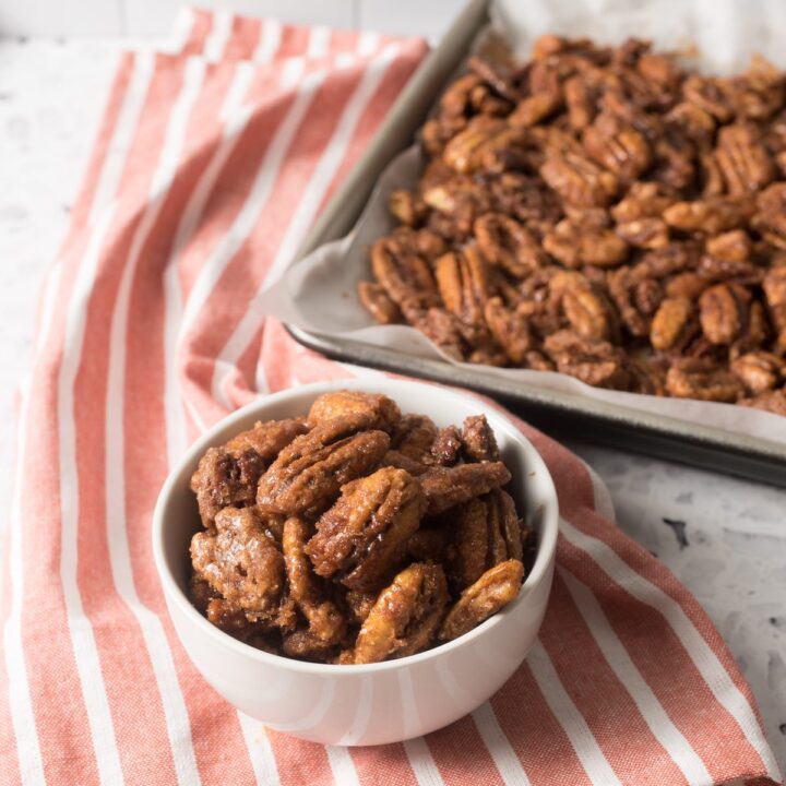 Pecans that have been evenly coated with sugar and cinnamon and baked in the oven like TikTok says to do!
