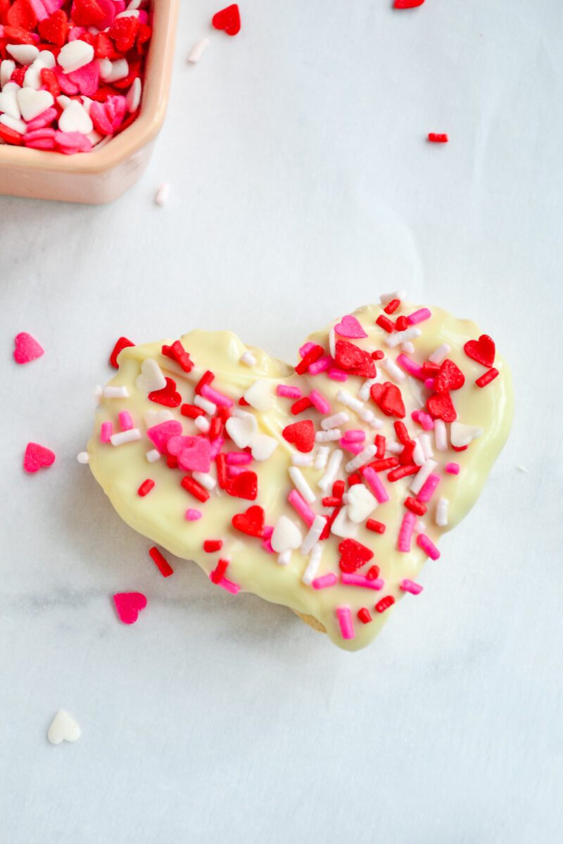 Rice Krispie treats dipped in white chocolate with Valentine Sprinkles on top