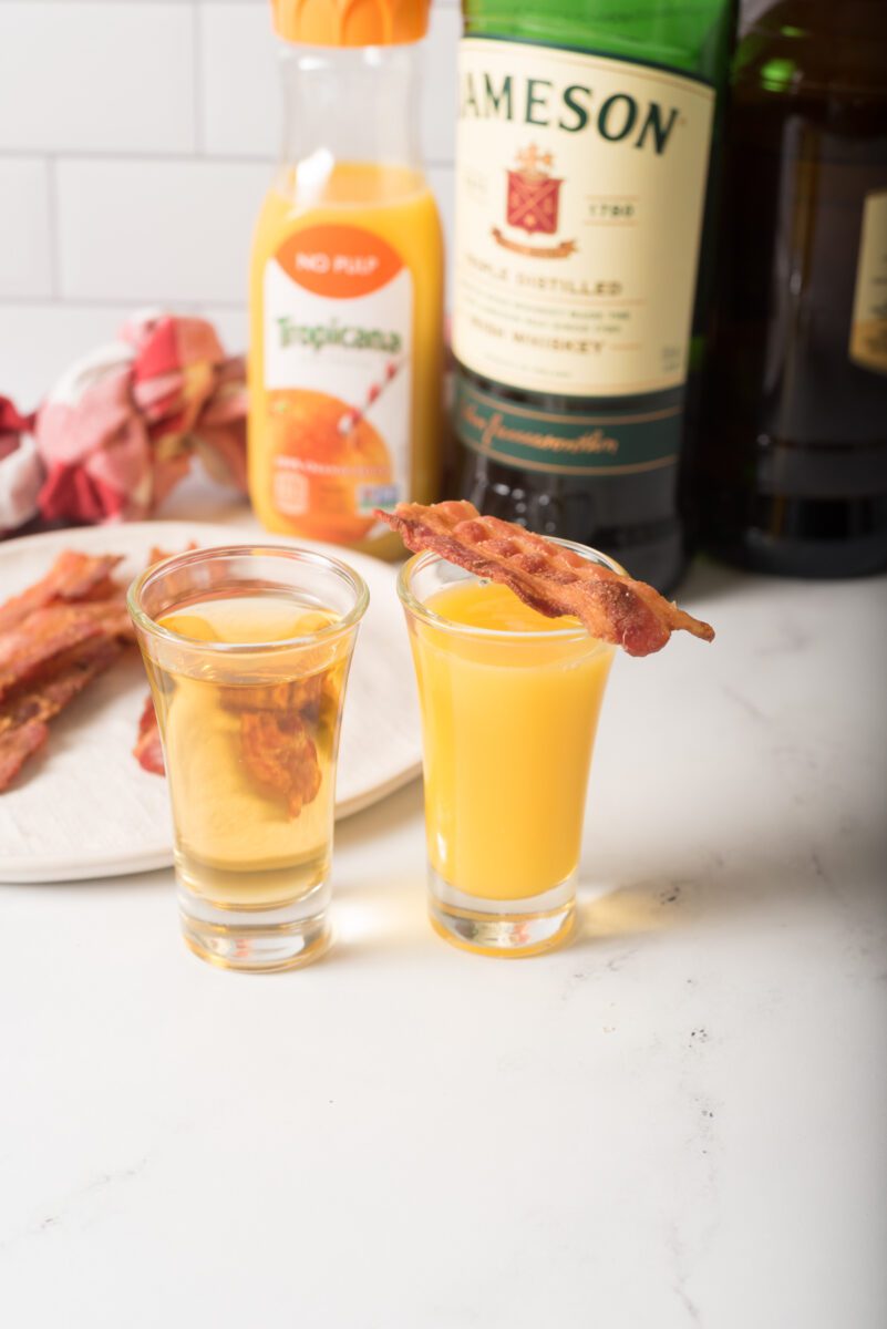 Shot Glasses- one with OJ and the other with Jameson Whiskey and Butterscotch Schnapps.