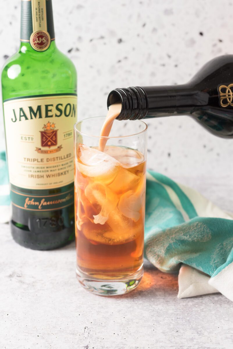 Jameson Whiskey and Bailey’s Irish Cream poured over a glass of ice.