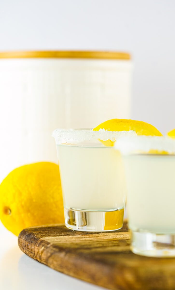 a shot glass with a sugar rim that has the classic Lemon Drop Shot inside
