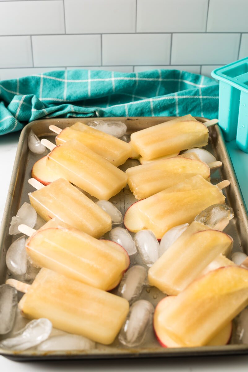 pan with ice and apple juice popsicles
