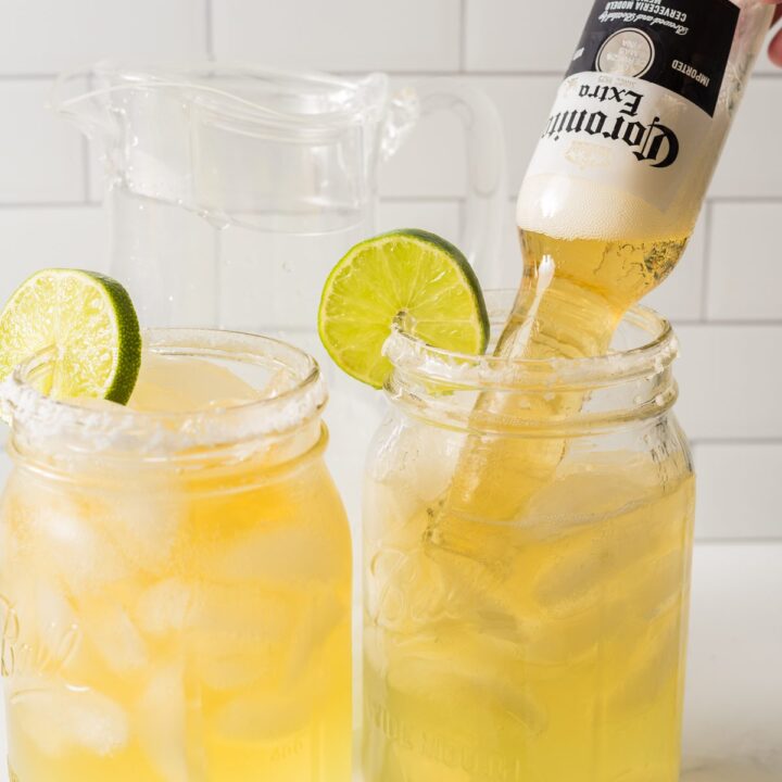 Margaritas made with a small beer bottle in a mason ball jar