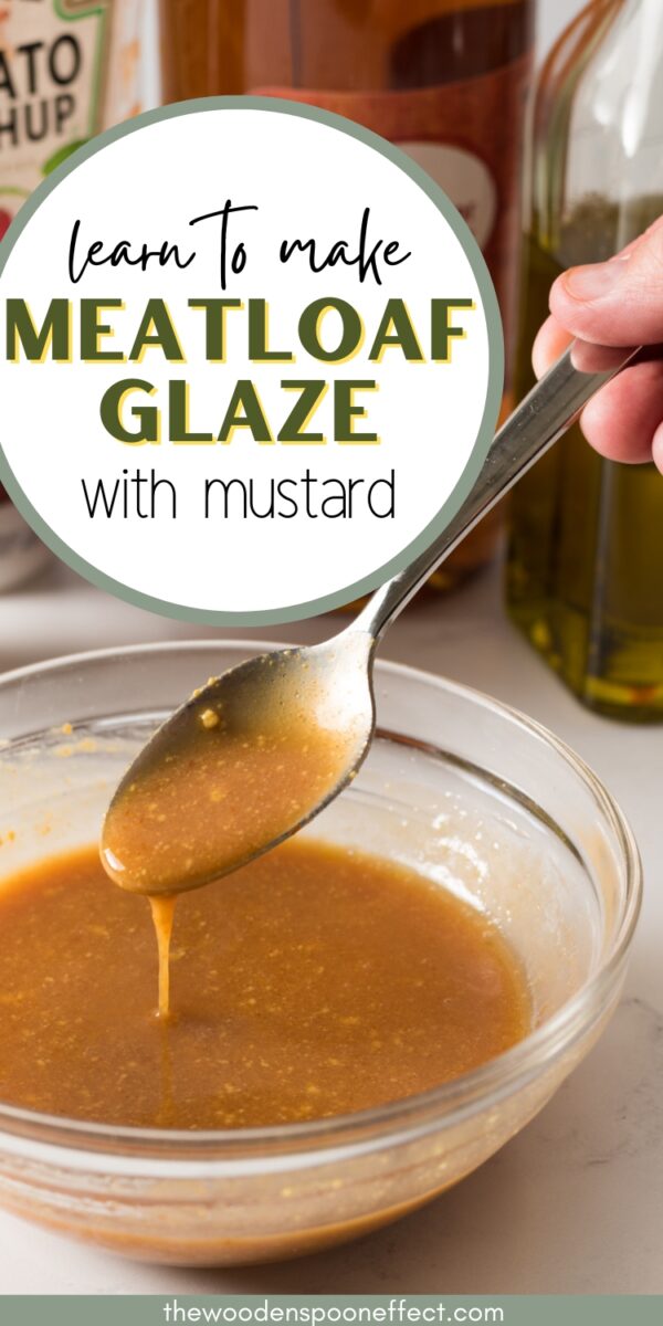 Meatloaf glaze with mustard in a glass bowl with a spoon.