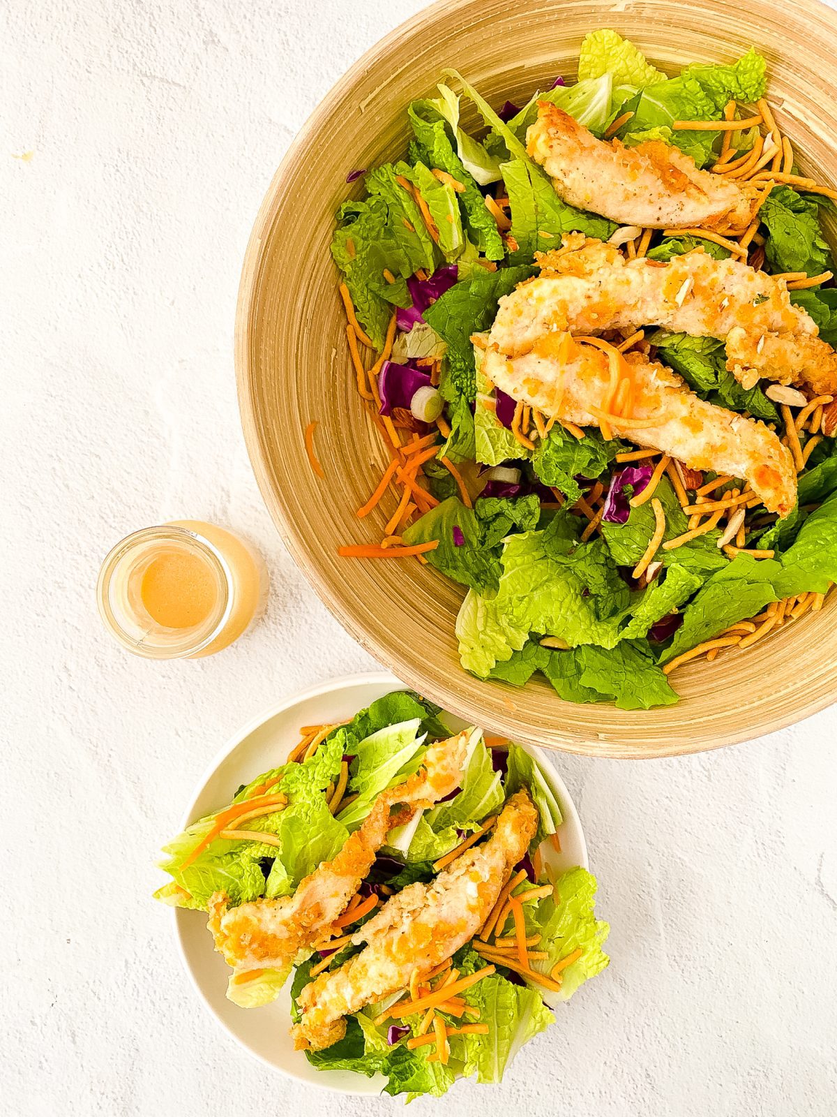 Large Bowl of chicken strips in oriental salad that is a copycat of Applebees recipe