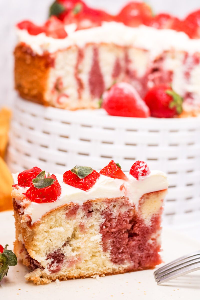 Poke cake made with vanilla cake mix and fresh strawberries