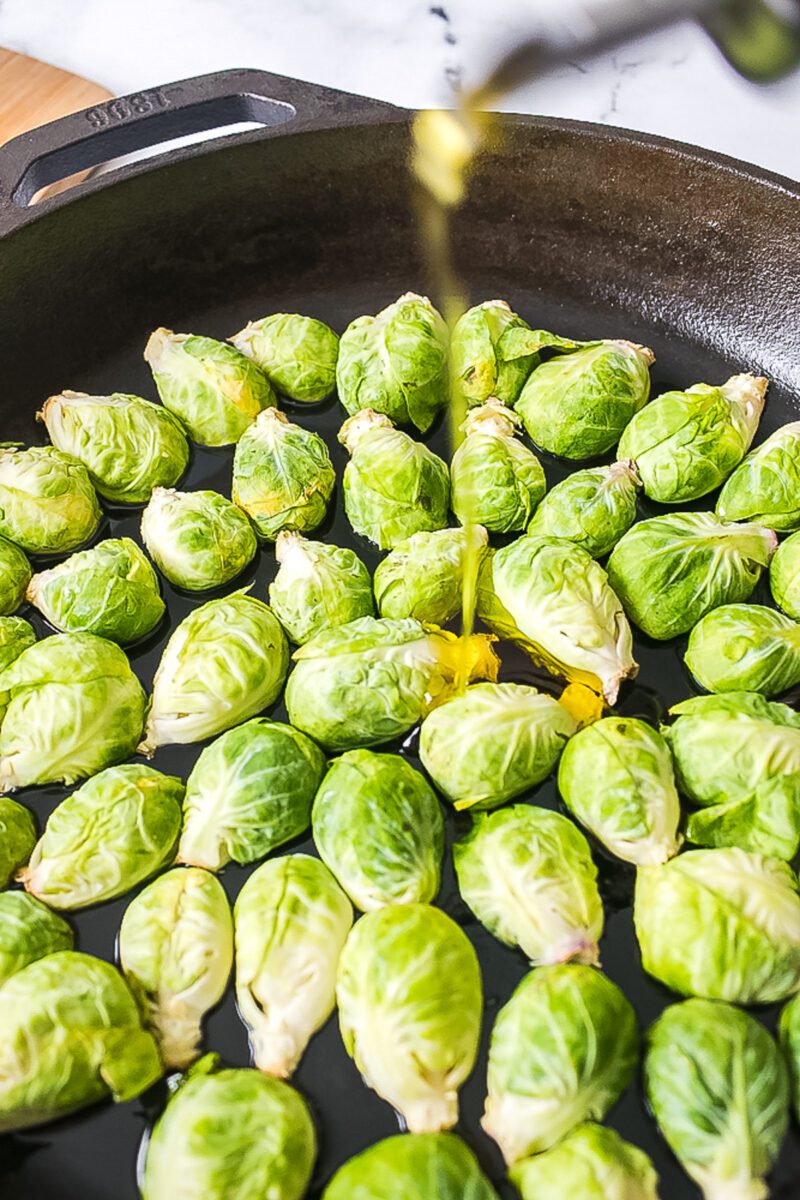 Fresh Brussels roasted in a cast iron skillet in the oven