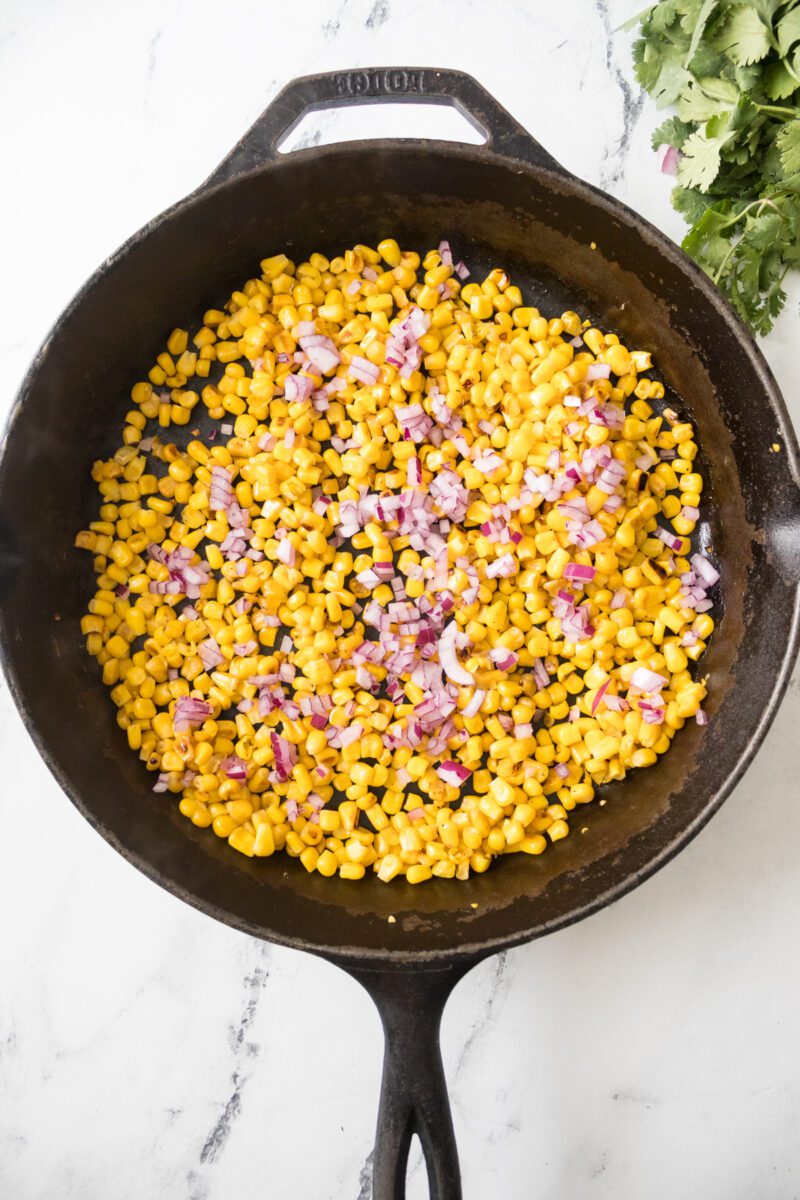 Traditional Mexican Street corn made in a non traditional way. Using a cast iron skillet.