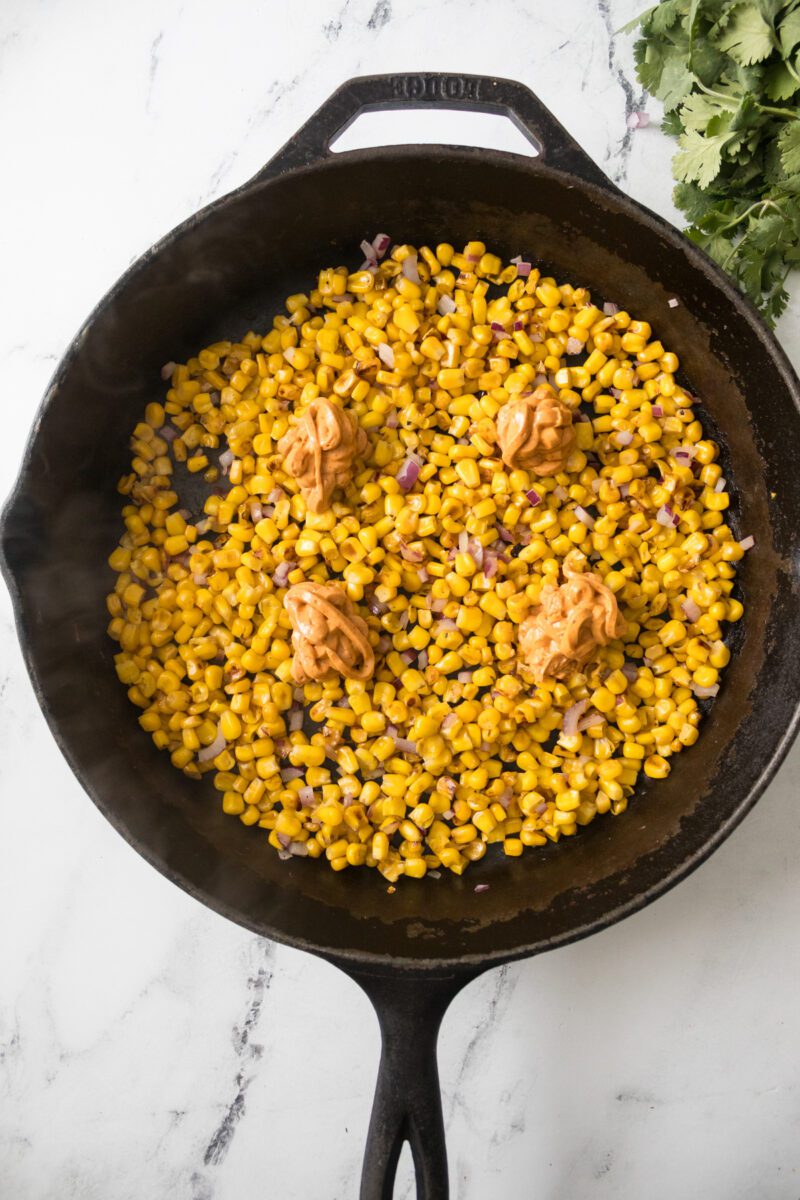 Traditional Mexican Street corn made in a non traditional way. Using a cast iron skillet.