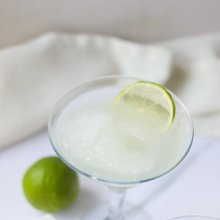 Margarita glass with a slushy margarita inside